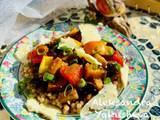 A picture of Warm aubergine salad with giant
wholewheat couscous and smoked cheese.